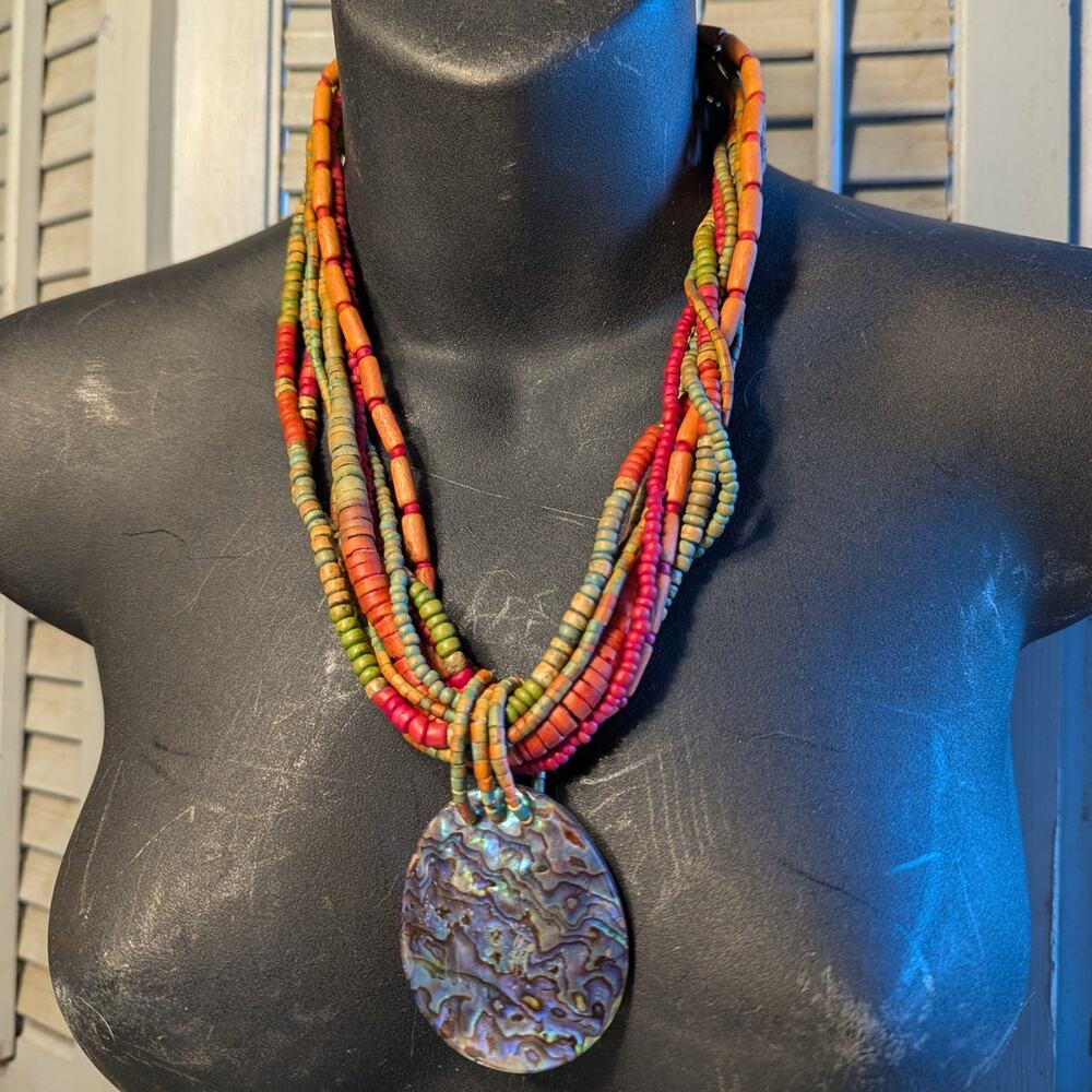 Multistrand wood bead necklace with mother of pearl pendant